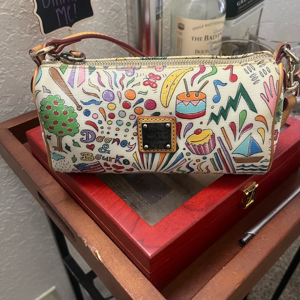 ** AUTHENTIC** Dooney and Bourke graffiti barrel bag *** RARE ***